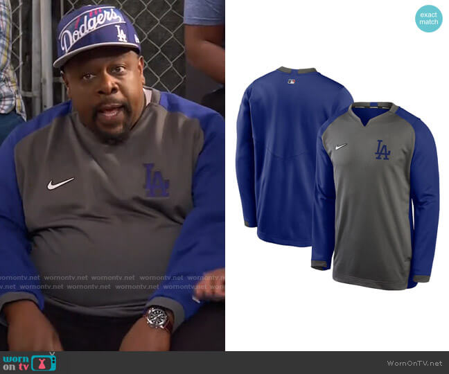 Nike Charcoal/Royal Los Angeles Dodgers Authentic Collection Thermal Crew Performance Pullover Sweatshirt worn by Calvin (Cedric The Entertainer) on The Neighborhood