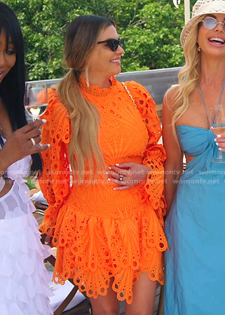 Adriana’s orange eyelet mini dress on The Real Housewives of Miami