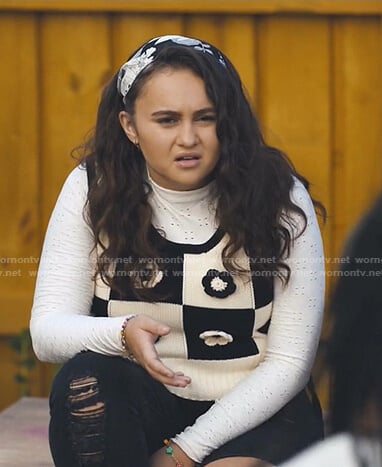 Annabelle’s black and white floral knit vest on Naomi