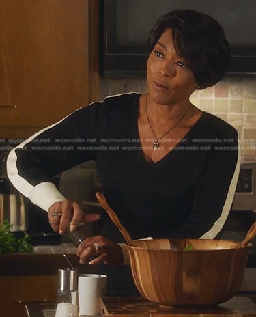 Athena’s black side-stripe v-neck sweater on 9-1-1