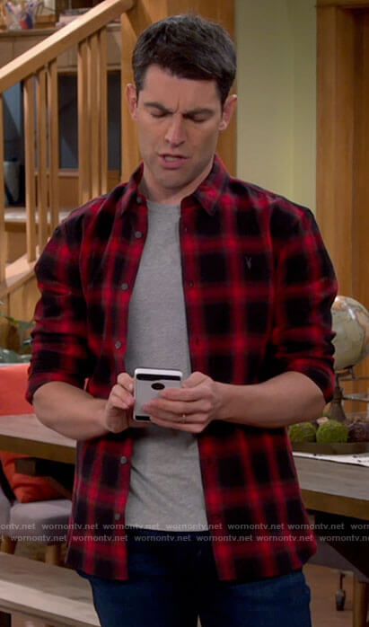 Dave’s red and black plaid shirt on The Neighborhood