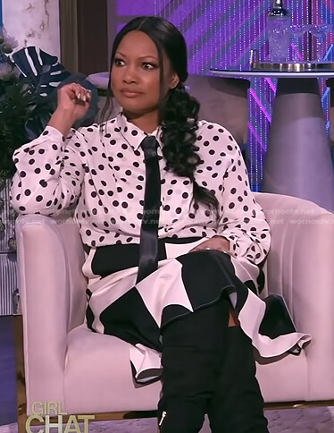 Garcelle’s white polka dot blouse and skirt on The Real