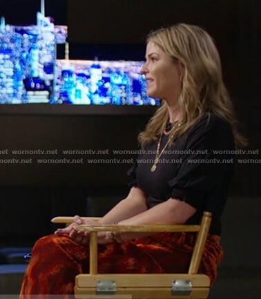 Jenna’s black top and orange velvet skirt on Today