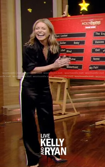 Kelly’s black blouse and side striped pants on Live with Kelly and Ryan