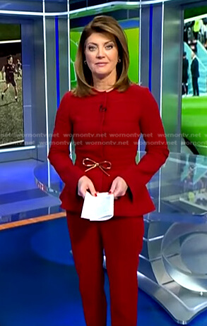 Norah’s red peplum jacket and pants on CBS Evening News