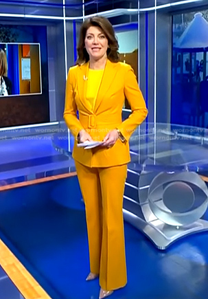 Norah’s yellow belted suit on CBS Evening News