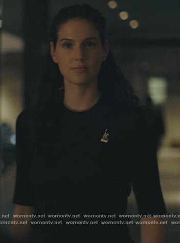 Rian’s black ribbed short sleeve sweater on Billions