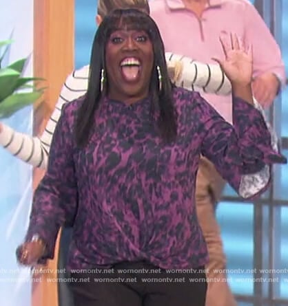 Sheryl’s purple animal print bell sleeve blouse on The Talk