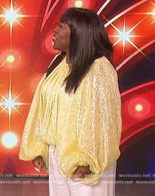 Sheryl’s yellow metallic top on The Talk