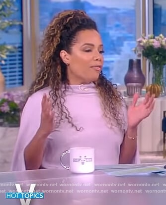 Sunny’s purple tie waist cape top on The View