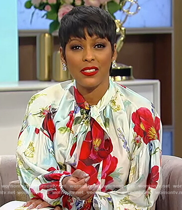Tamron’s blue floral print tie neck blouse on Tamron Hall Show