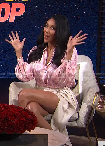 Tayshia’s pink printed blouse and draped mini skirt on E! News Post Pop