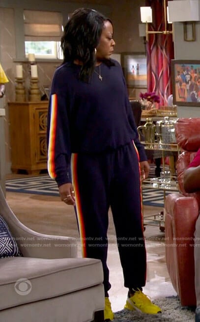 Tina’s side striped sweatshirt and pants set with yellow sneakers on The Neighborhood