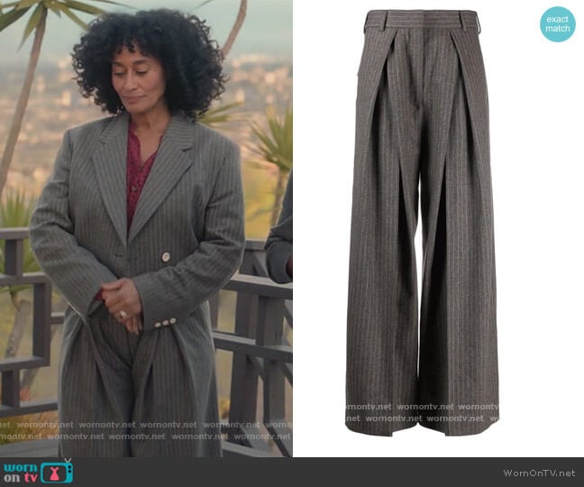 Acne Studios Pinstripe box pleated flared trousers worn by Rainbow Johnson (Tracee Ellis Ross) on Black-ish