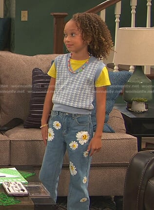 Alice’s blue houndstooth vest and floral jeans on Ravens Home