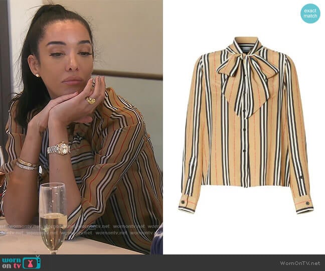 Burberry Icon Stripe pussy-bow blouse worn by Noella Bergener on The Real Housewives of Orange County