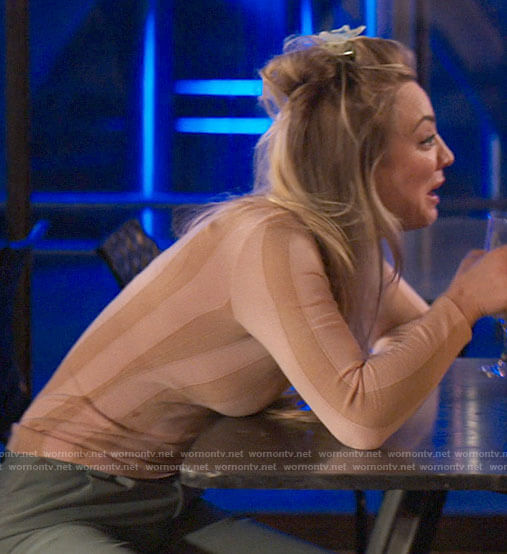 Cassie’s pink striped top on The Flight Attendant