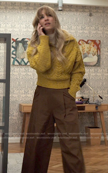 Cassie’s yellow cable knit sweater and brown wide leg pants on The Flight Attendant