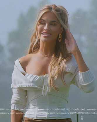 Chrishell’s white cropped off shoulder cardigan  on Selling Sunset