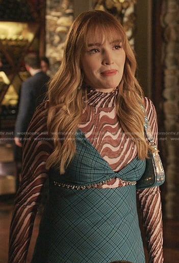 Kirby’s brown printed top and blue plaid dress on Dynasty