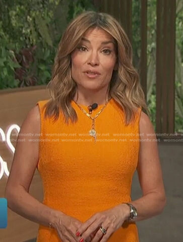Kit’s orange textured sleeveless dress on Access Hollywood