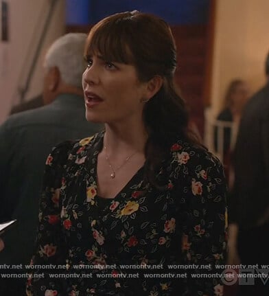 Marina’s black floral print blouse on Home Economics