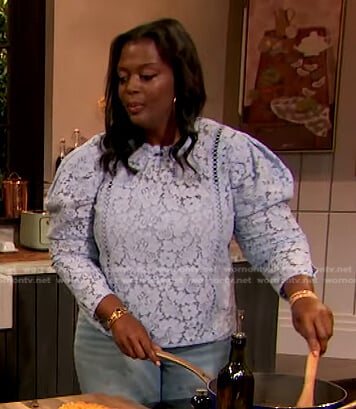Millie Peartree’s blue puff sleeve lace top on The Drew Barrymore Show