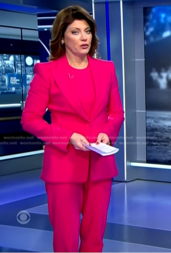 Norah’s fuchsia pink suit on CBS Evening News