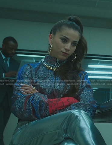 Rebe’s red long sleeve top and glitter jacket on Elite