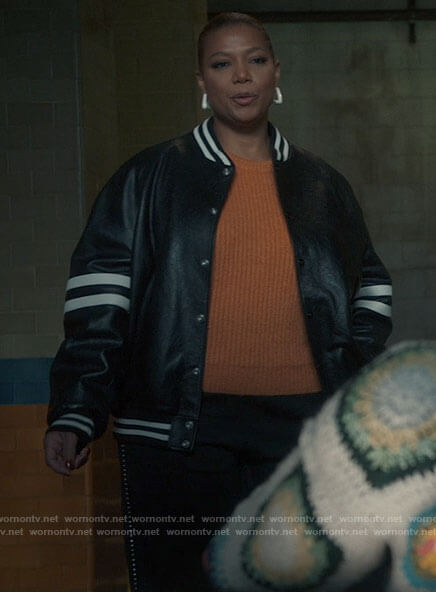 Robyn’s leather bomber jacket with striped sleeves on The Equalizer