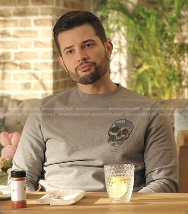 Sam’s grey skull print sweatshirt on Dynasty