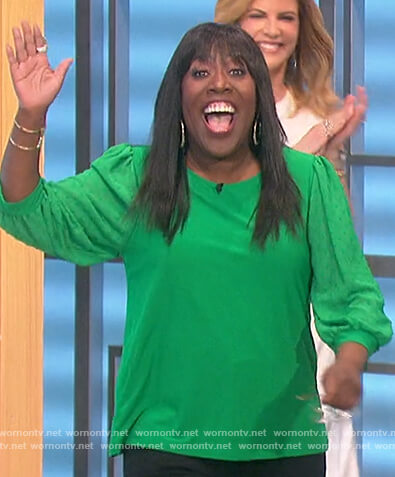 Sheryl’s green sheer sleeve top on The Talk