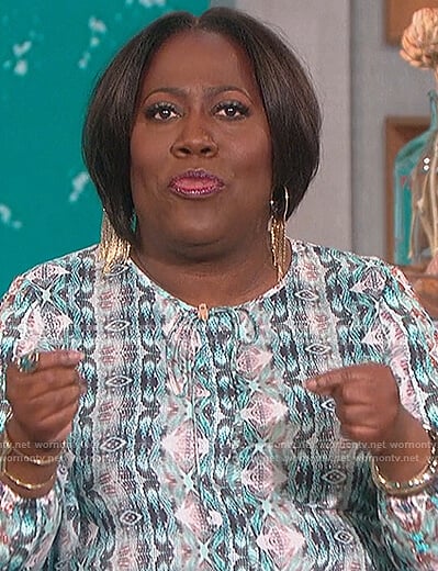 Sheryl’s green snake print top on The Talk
