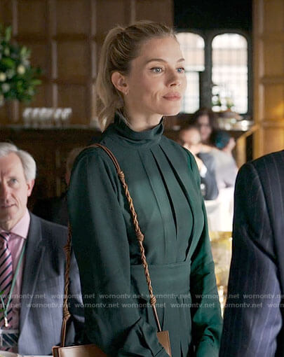 Sophie’s dark green pleated dress on Anatomy of a Scandal