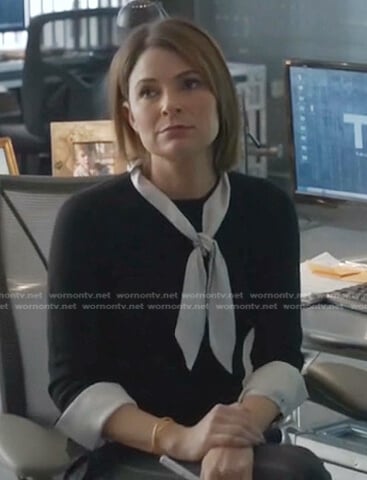 Taylor’s black top with contrast tie on Bull