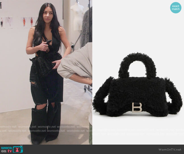 Balenciaga Small Hourglass Shearling Handbag worn by Kim Kardashian (Kim Kardashian) on The Kardashians