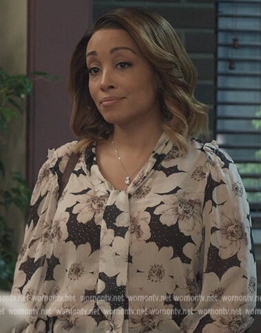 Tina Hick’s floral blouse on All American Homecoming