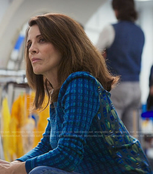 Carol’s bug print sweater on The Flight Attendant
