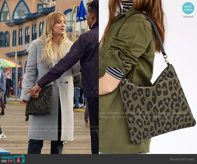 Clare V Army Pablo Cat Suede Foldover Clutch worn by Cassie Bowden (Kaley Cuoco) on The Flight Attendant