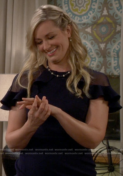 Gemma’s navy dress with sheer shoulders on The Neighborhood