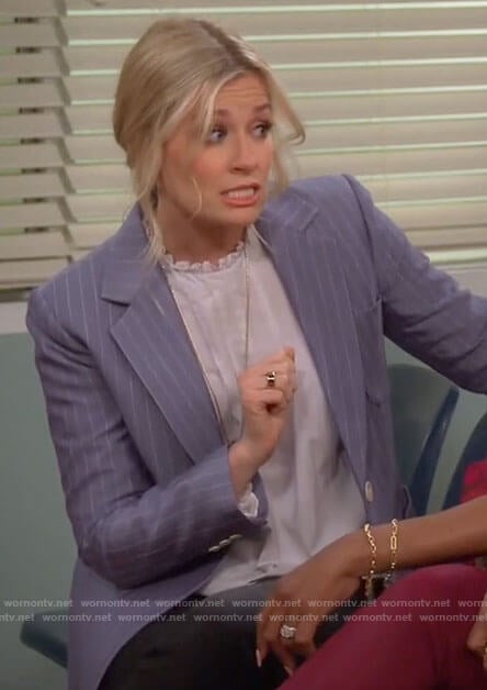 Gemma’s pinstripe blazer and white ruffle neck top on The Neighborhood