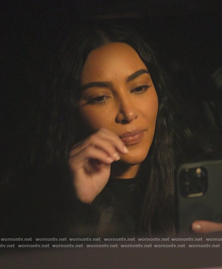 Kim’s black logo mock neck top on The Kardashians