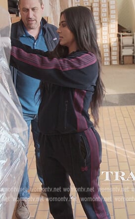 Kim’s black velour track jacket and pants on The Kardashians