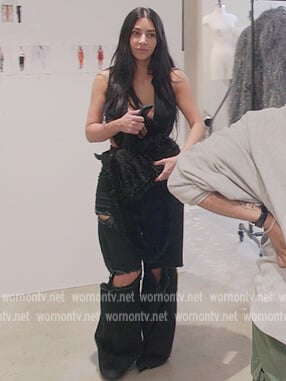 Kim’s black distressed denim jeans on The Kardashians