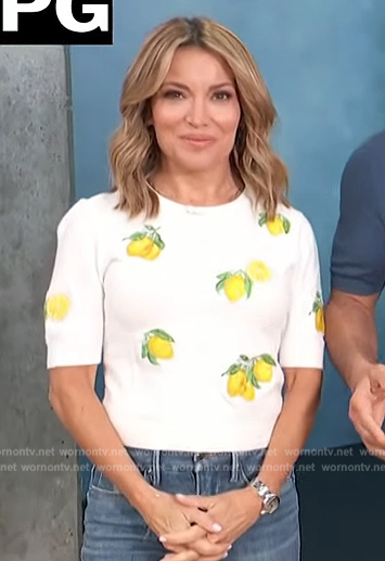 Kit’s white lemon sweater on Access Hollywood