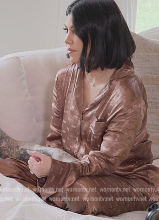 Kim’s brown satin logo pajamas on The Kardashians