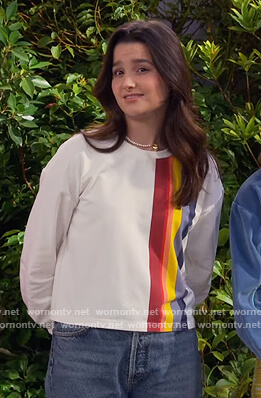 Lex’s white rainbow stripe sweater on Side Hustle