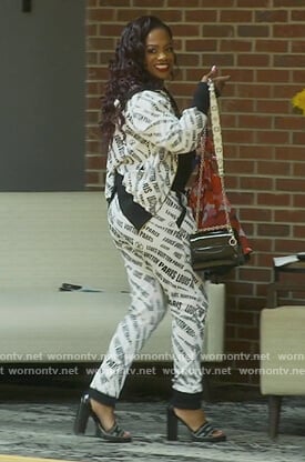 Kandi’s white Loui Vuitton logo track jacket on The Real Housewives of Atlanta