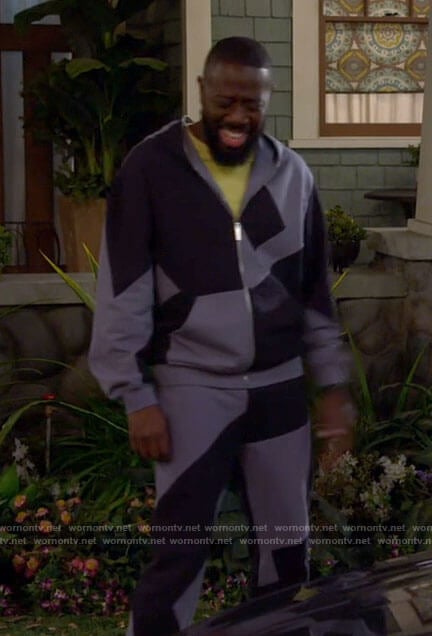Malcolm’s blue colorblock hoodie and sweatpants on The Neighborhood