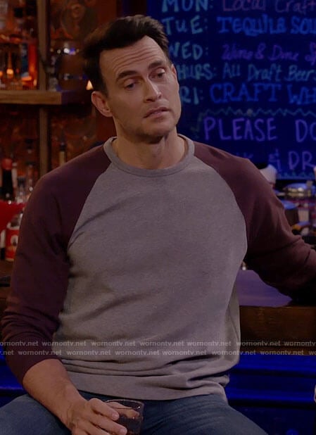 Max’s grey shirt with purple sleeves on Call Me Kat